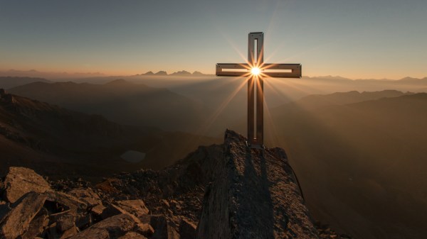 cross with sun at sunrise